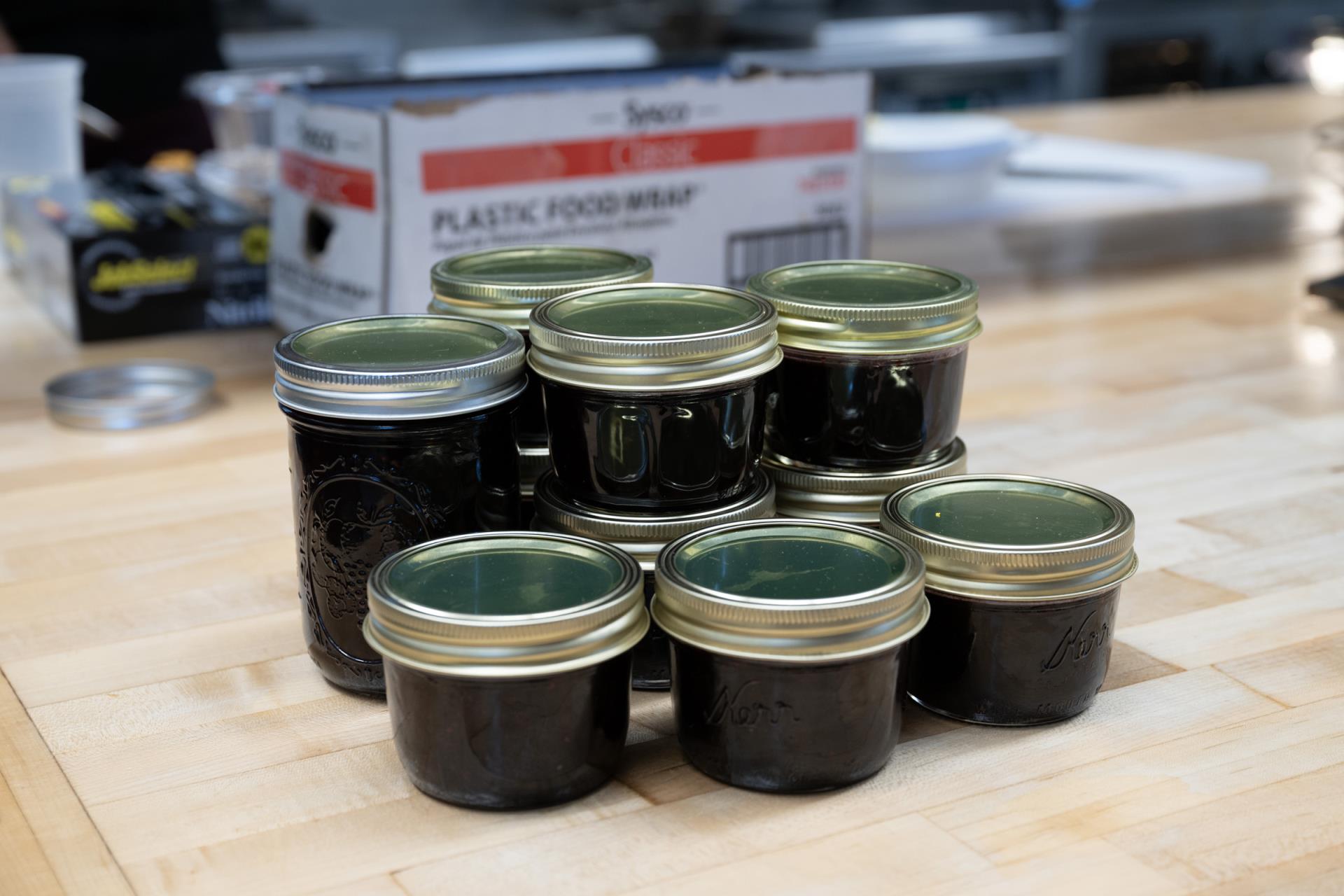 Sous Chef Thomas Buckner canned preserves made from blackberries harvested from Governor Mike Kehoe's farm.