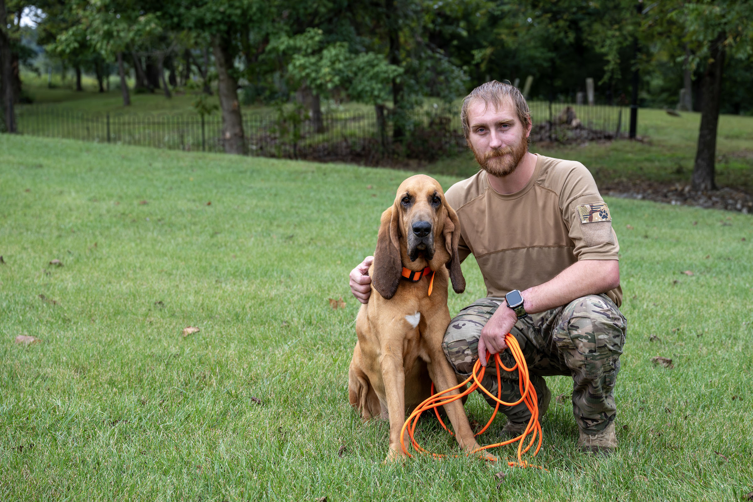 Dog and officer pose for photo
