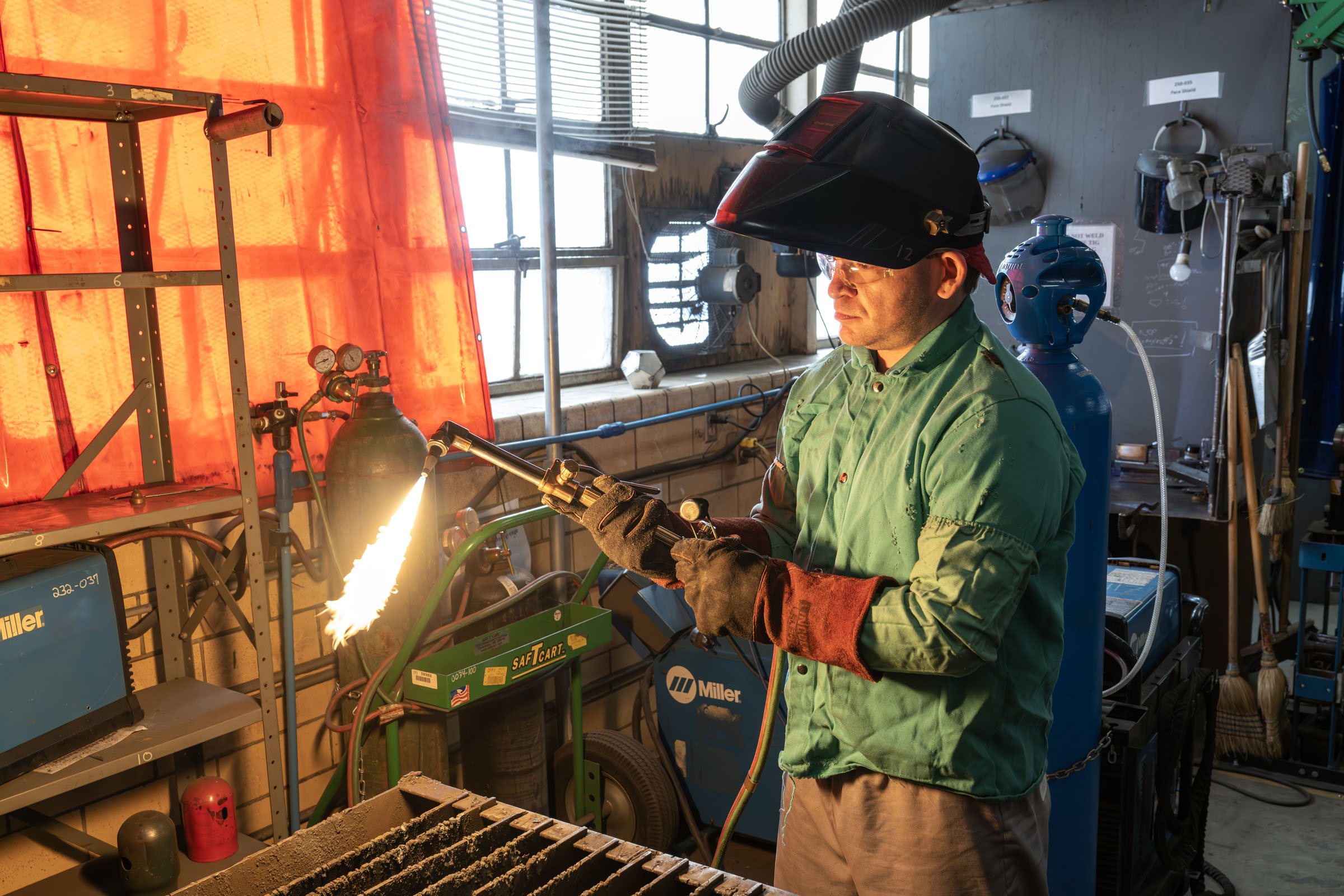 Student uses welding torch