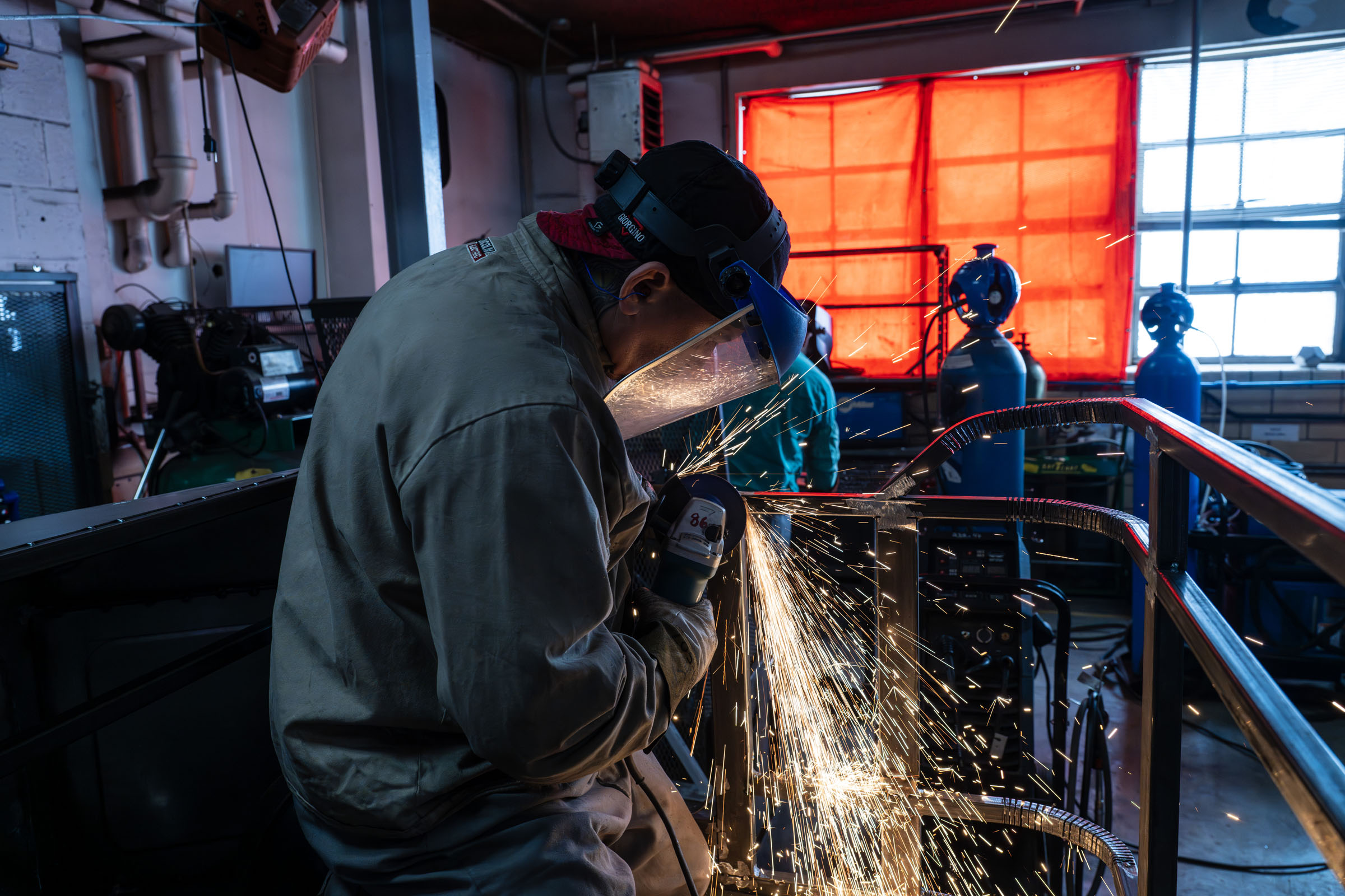 Student welds material